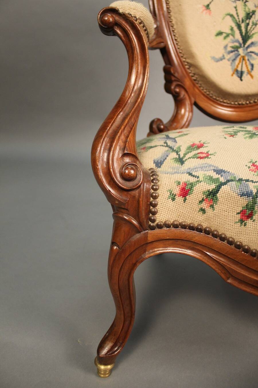 Pair of Louis Philippe armchairs with petit point upholstery.