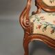Pair of Louis Philippe armchairs with petit point upholstery.
