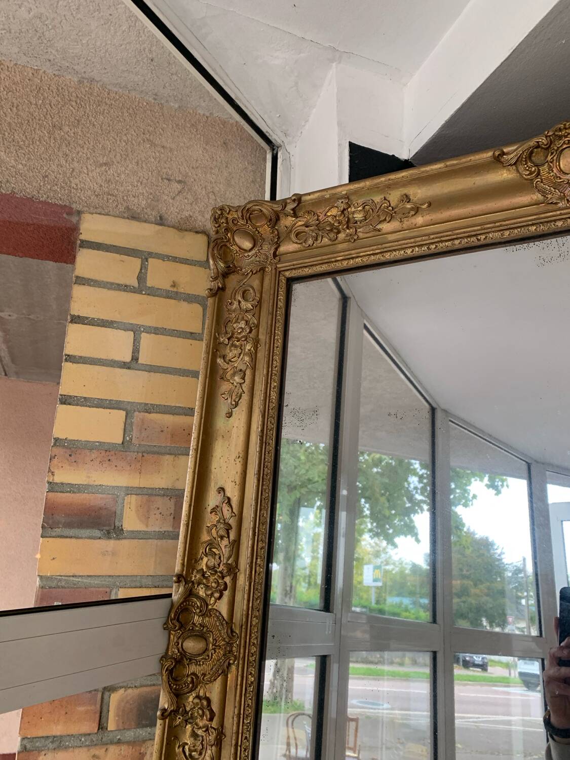 Old gilded mirror fireplace, 19th century restoration