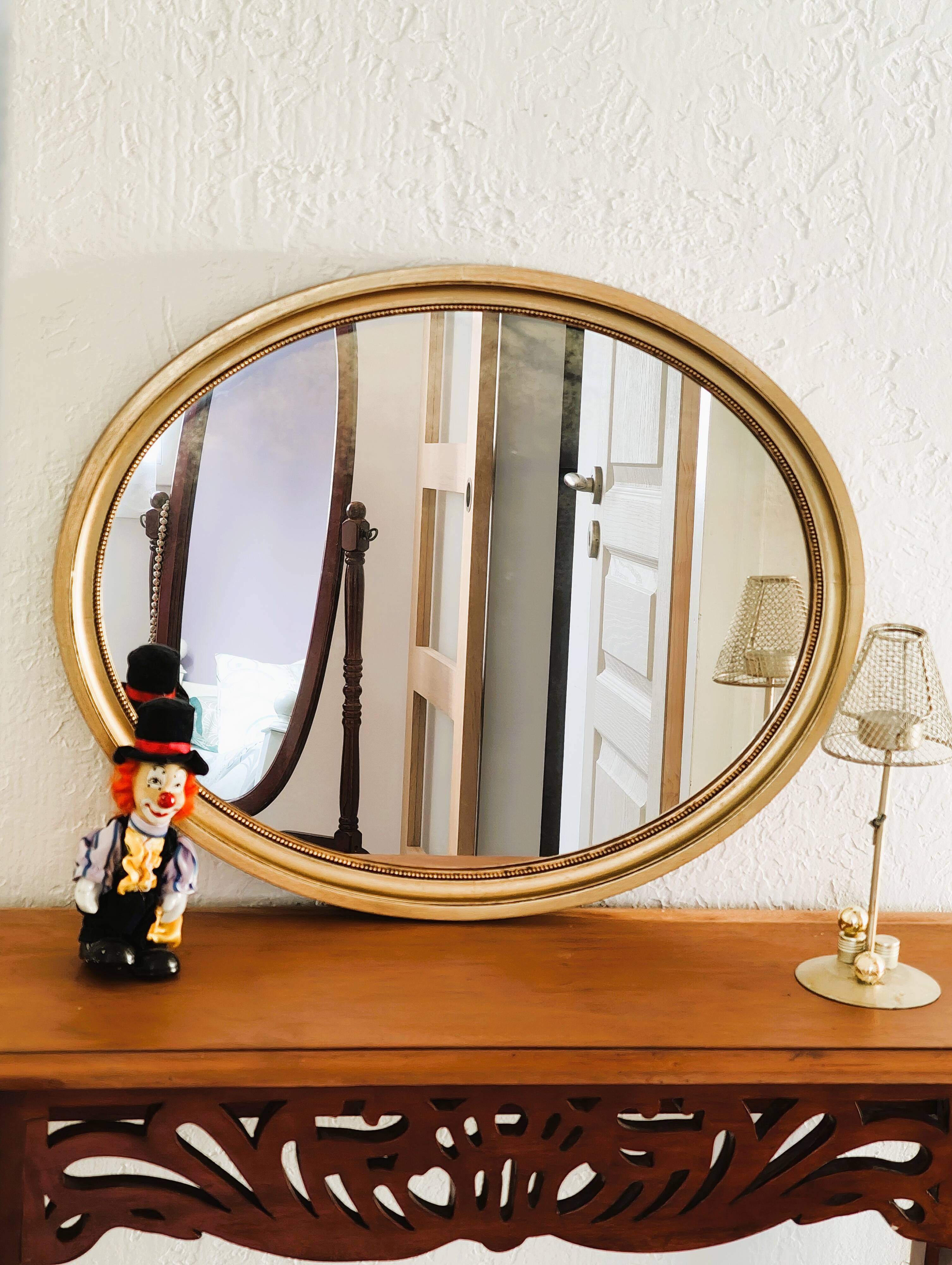 Antique gold oval mirror