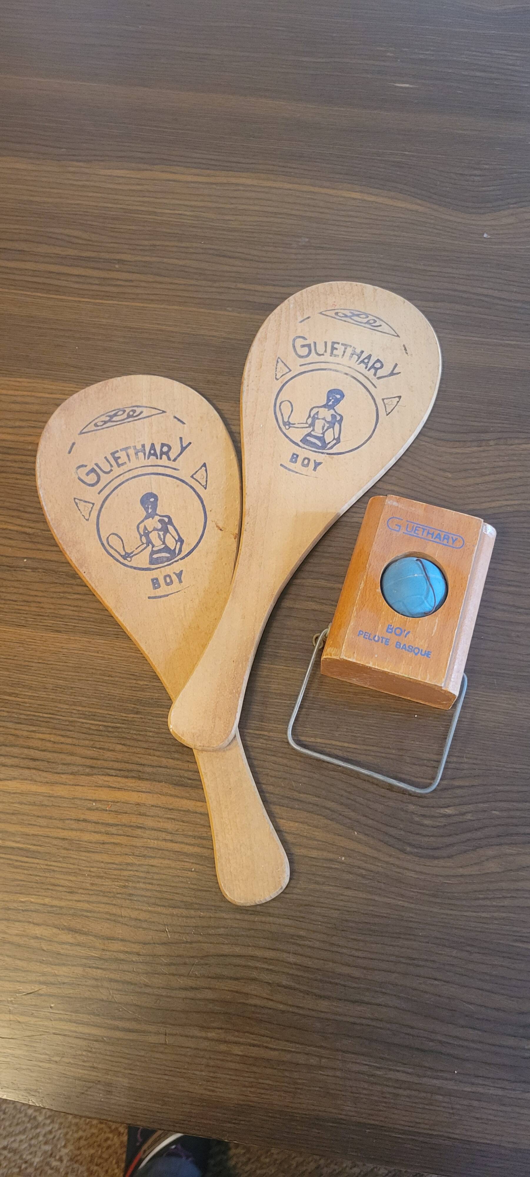 Basque pelota game with 2 rackets and 1 ball from the 50s and 60s, Guéthary boy in wood.