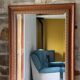 Large bevelled tabletop mirror in carved gilded wood.