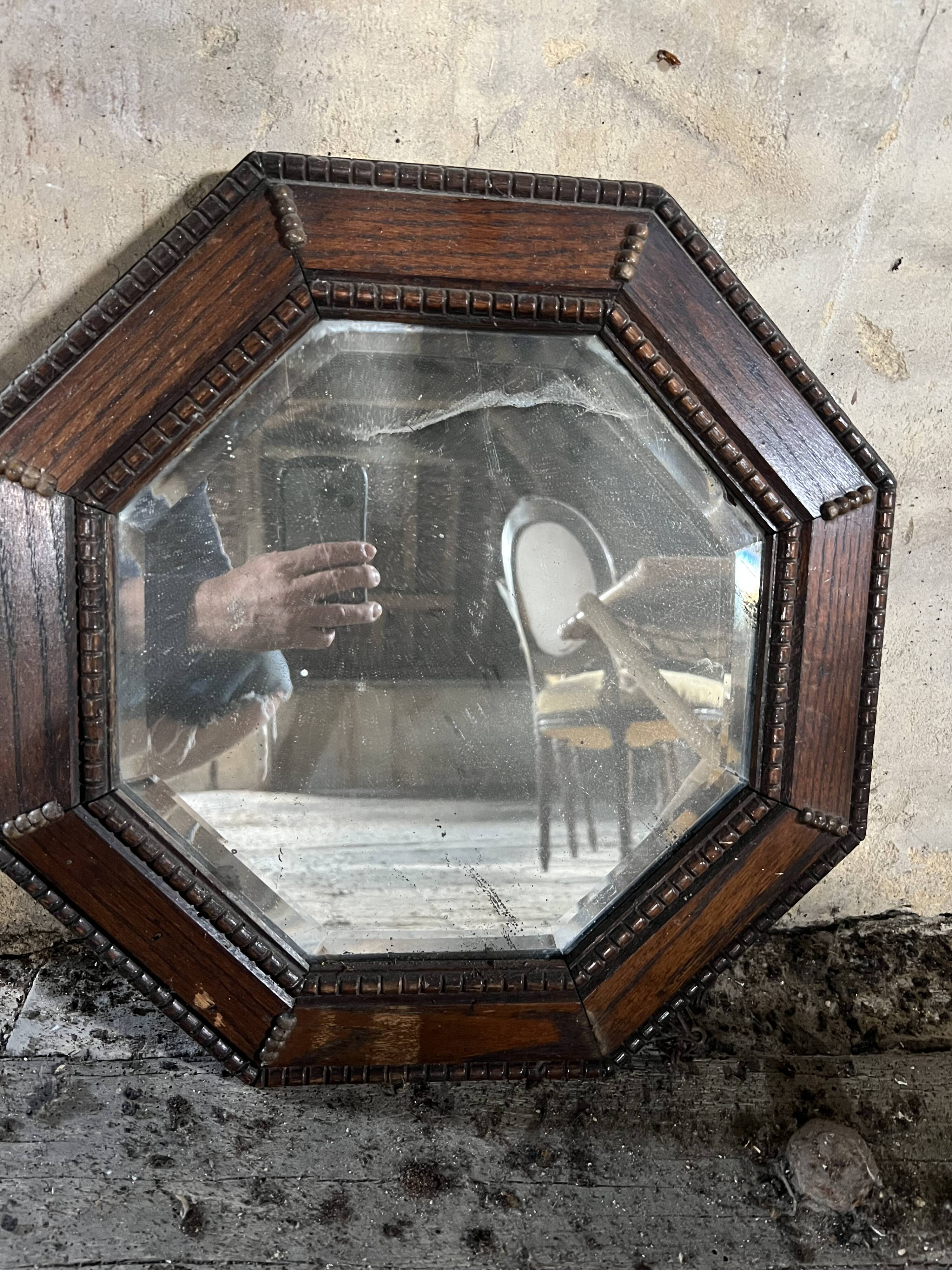 Antique octagonal mirror in dark wood – pearl decoration