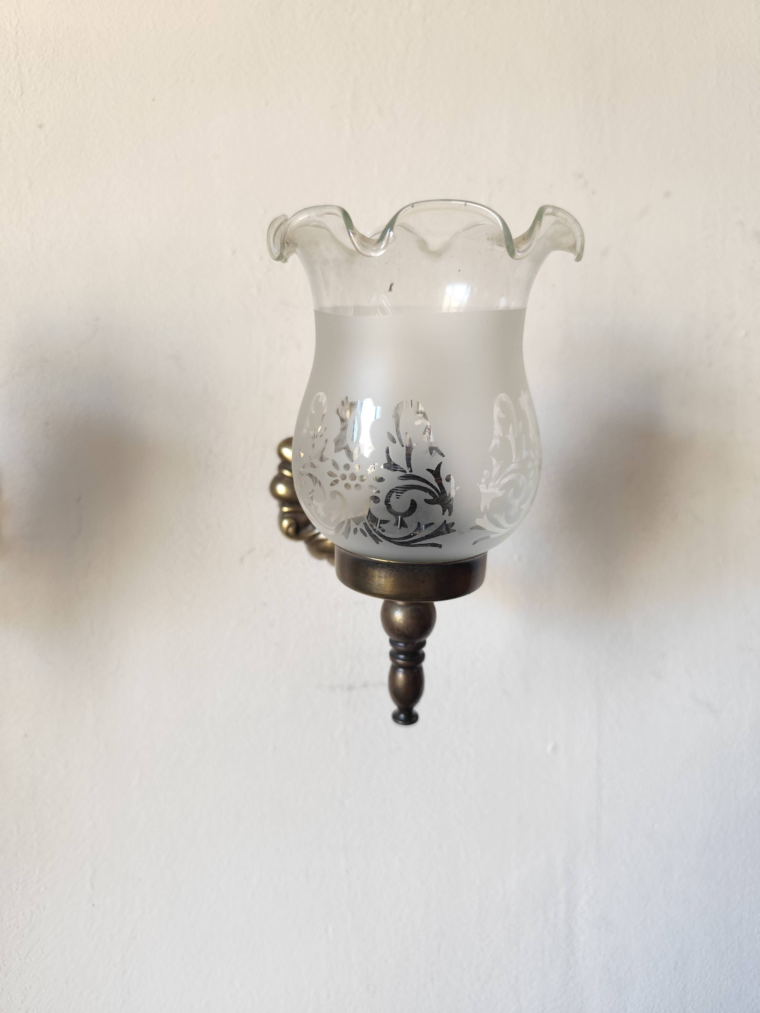 Pair of wall sconces in bronze with opaline glass tulips.