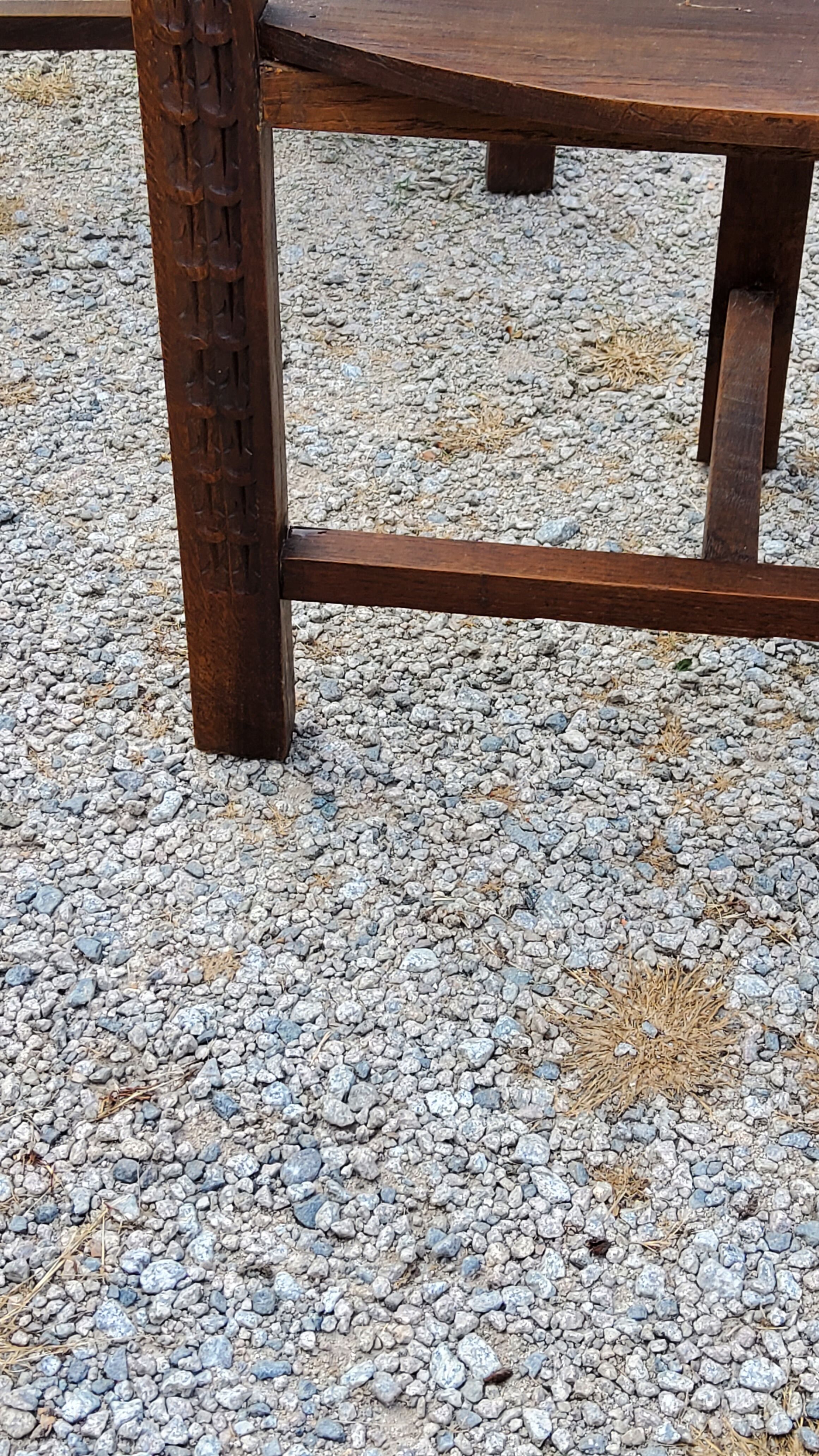 Set of three brutalist tripod armchairs in carved solid oak