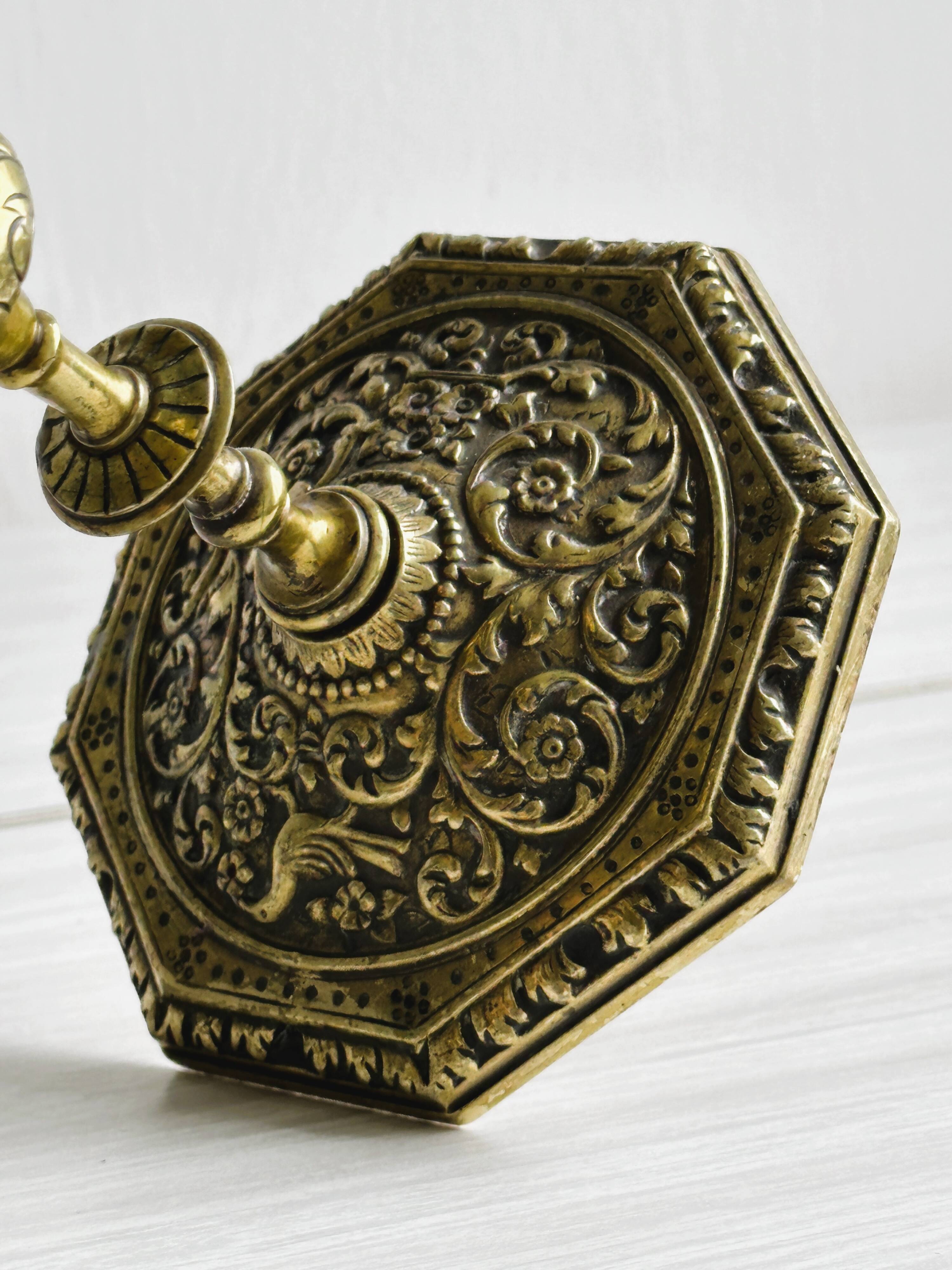 Carved brass candlestick holder