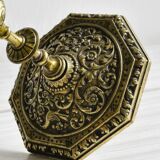 Carved brass candlestick holder