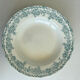A deep plate in blue and green ironstone, antique French earthenware.