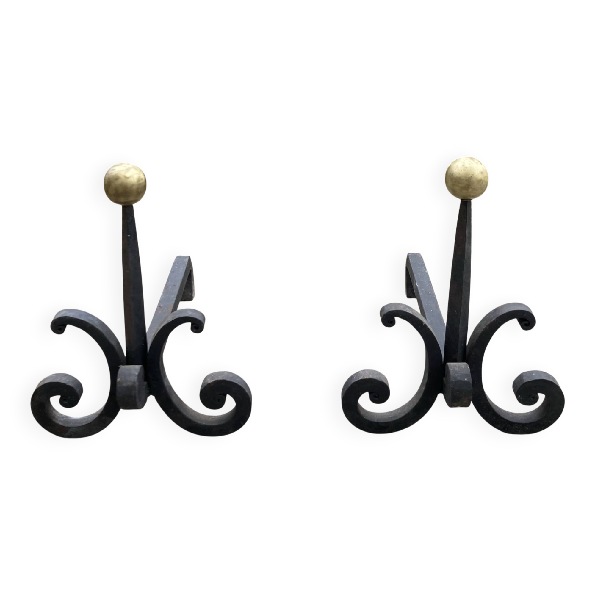Massive wrought iron chenets from the 19th century topped with brass balls.