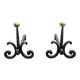 Massive wrought iron chenets from the 19th century topped with brass balls.