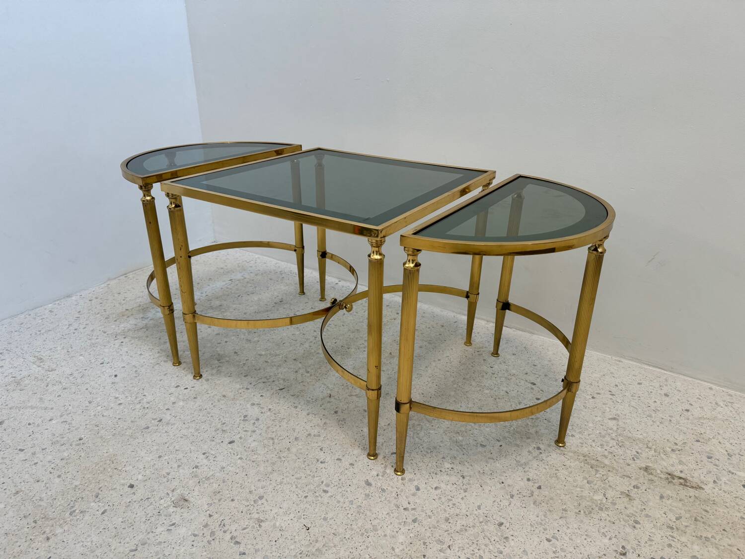 Neo classic coffee table in brass and smoked glass
