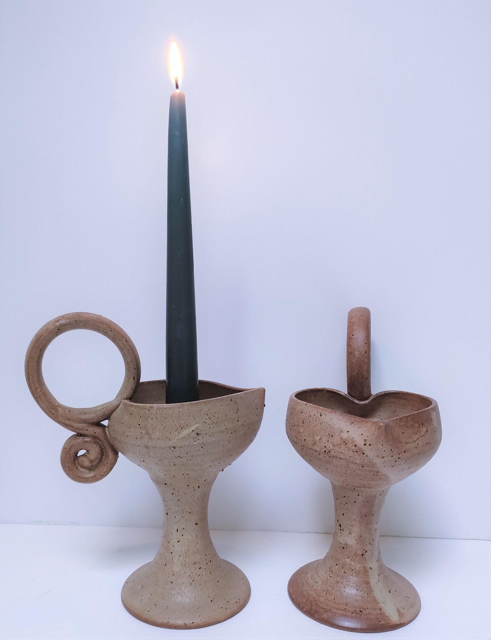 Pair of vintage “heart” sandstone candlesticks