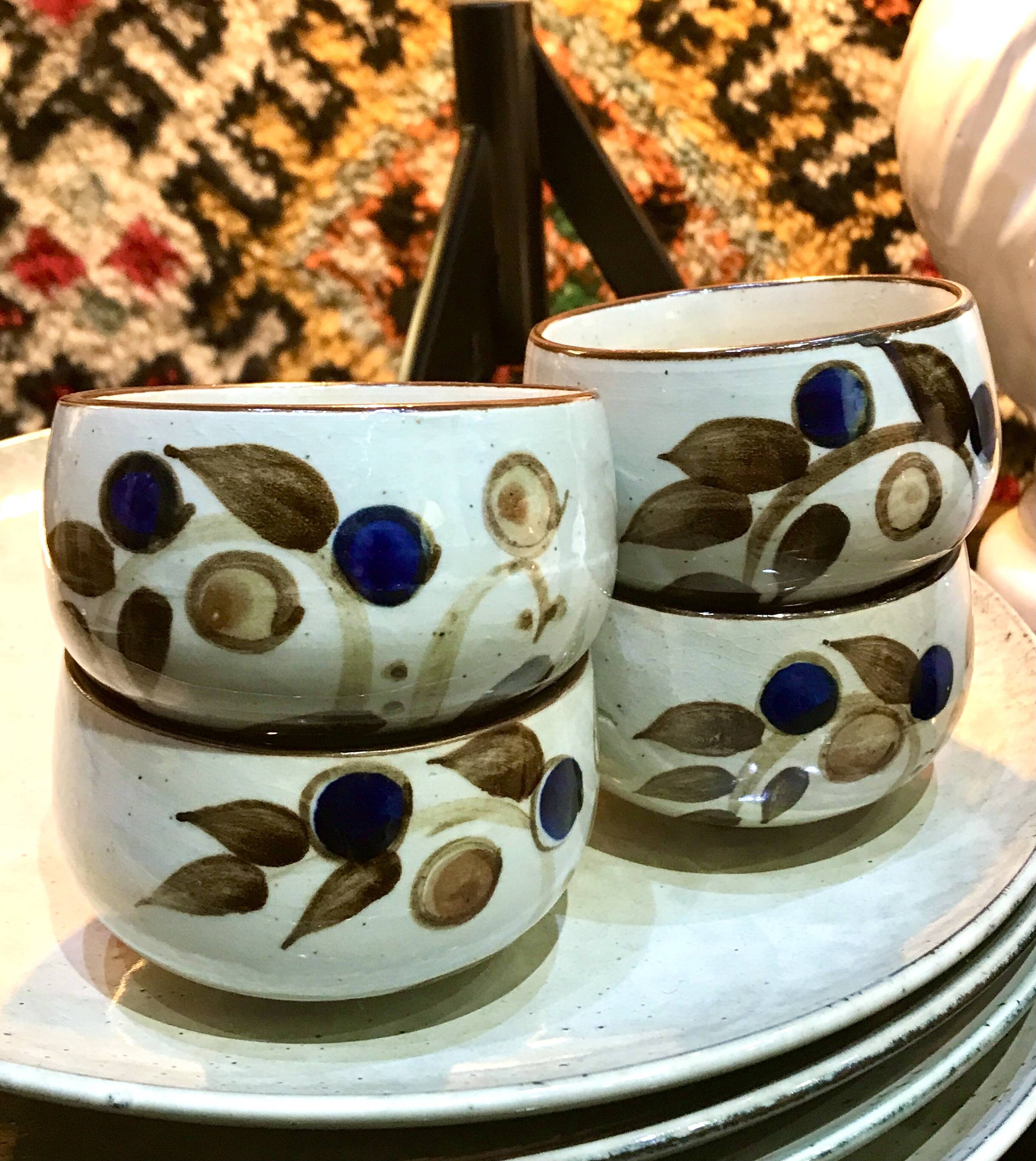 Enamelled stoneware tea bowls with plant decor