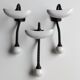Trois patères doubles en fer forgé et porcelaine