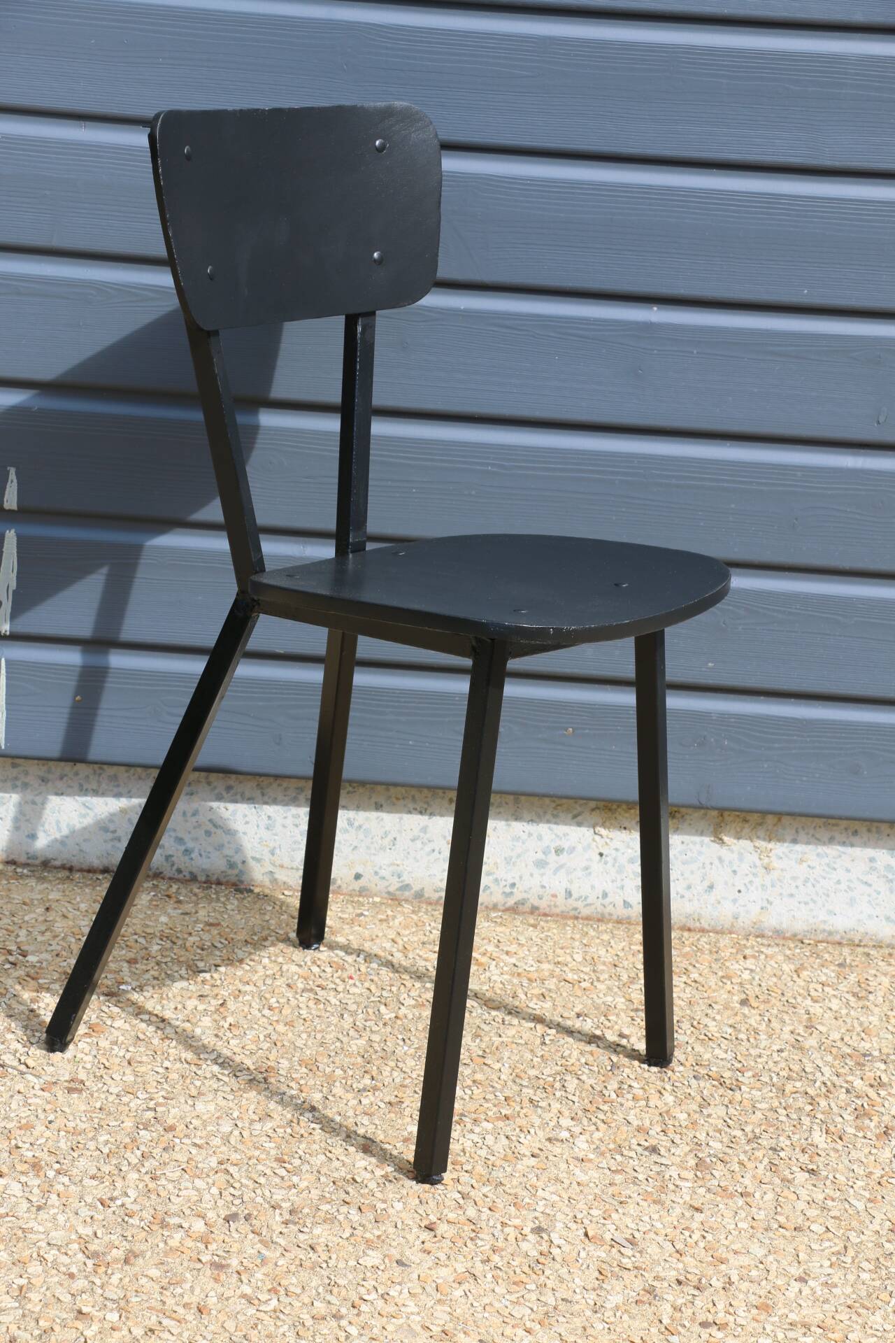 4 black metal and wood chairs