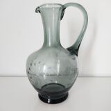 Engraved glass pitcher