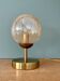 Lampe à poser globe vintage en verre ambré
