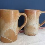 Suite of five sandstone mugs