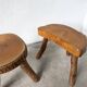 Set of three rustic solid wood tripod stools.