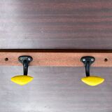 Coat rack with 2 yellow and black hooks