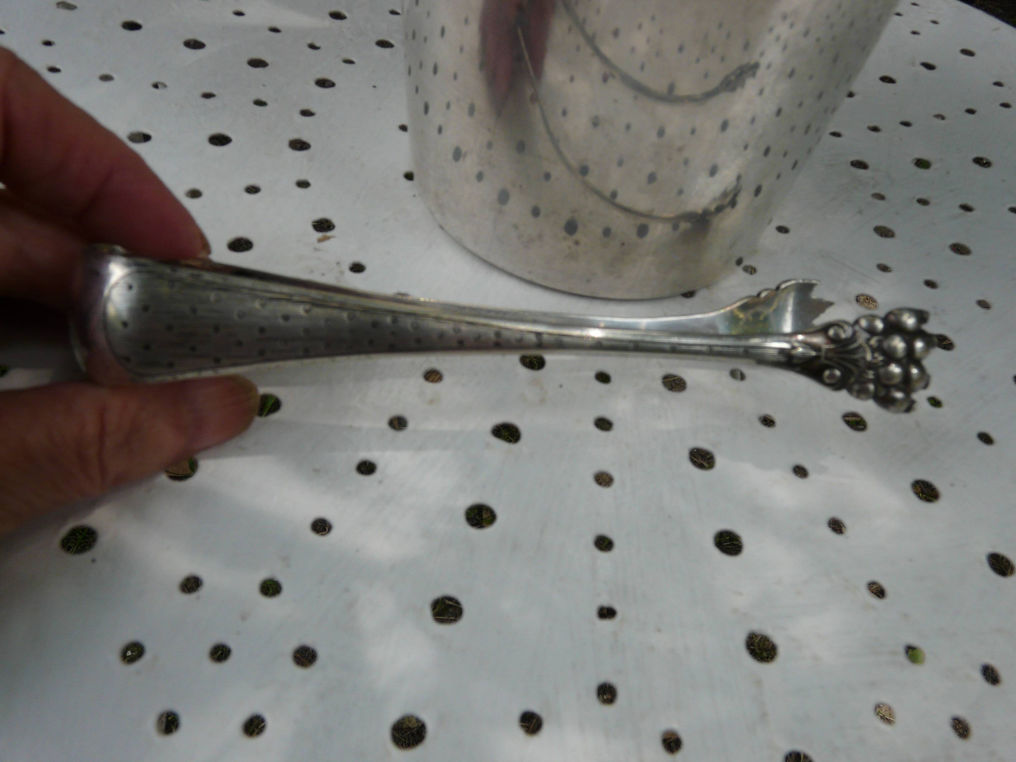 Silver metal ice bucket with its lion's pate tongs