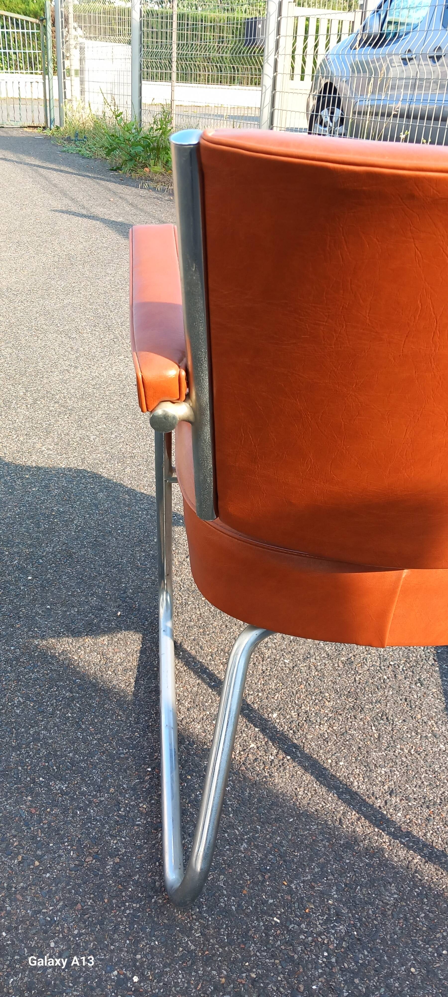 Vintage leatherette and chrome armchair