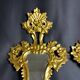 Pair of carved and gilded wooden mirrors, Italian Baroque style, 19th century.