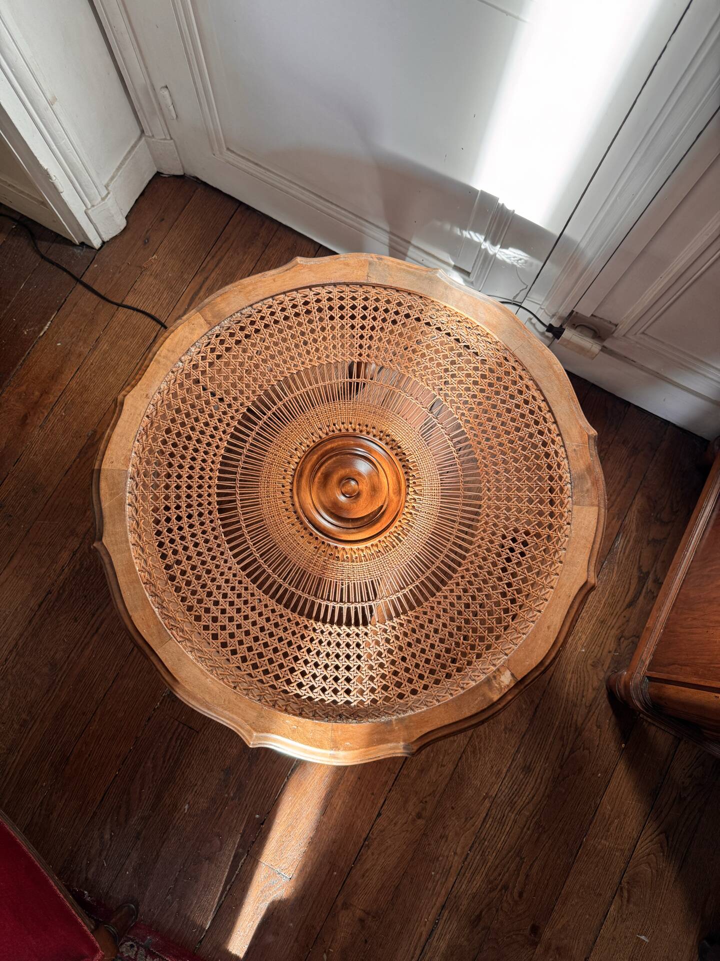 Round coffee table in Louis XV style, with sun cane and glass top.