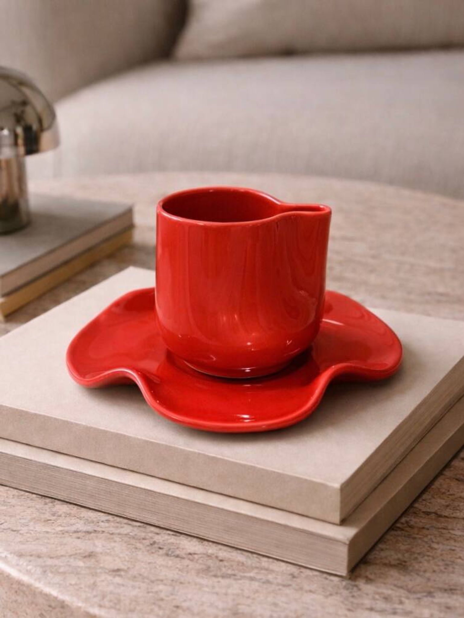 Set of wavy ceramic cup and saucer - poppy red