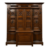 Important neo-Gothic entrance wardrobe in carved oak with chest.
