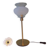 Table lamp with gold metal base and vintage white glass lampshade