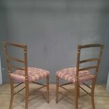 Pair of upholstered chairs in gilded wood