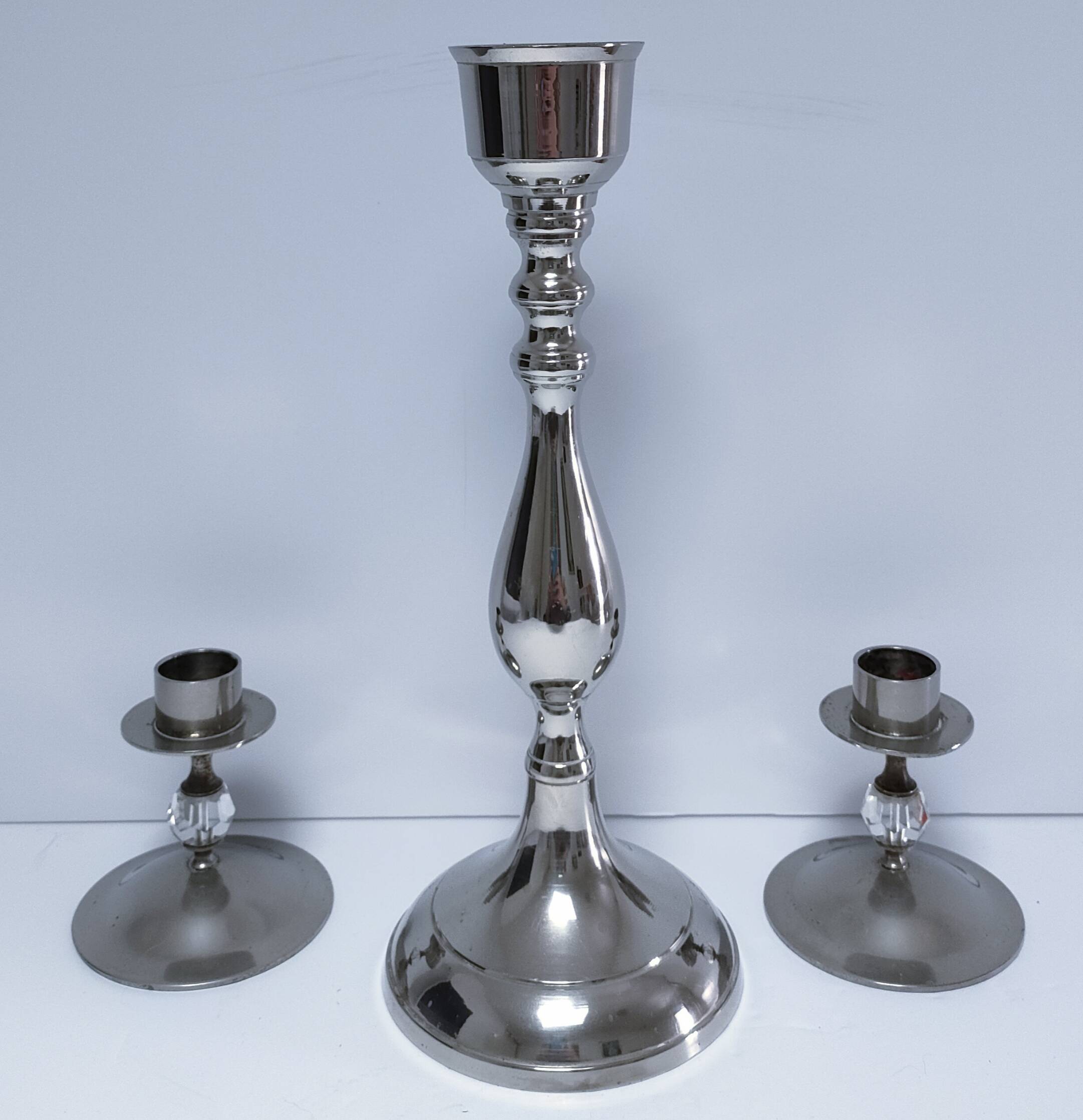 Three vintage metal chrome glass candlesticks