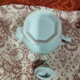 old coffee maker in white earthenware and red edging