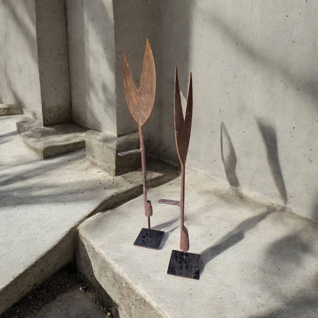 Pair of hay cutters on stands