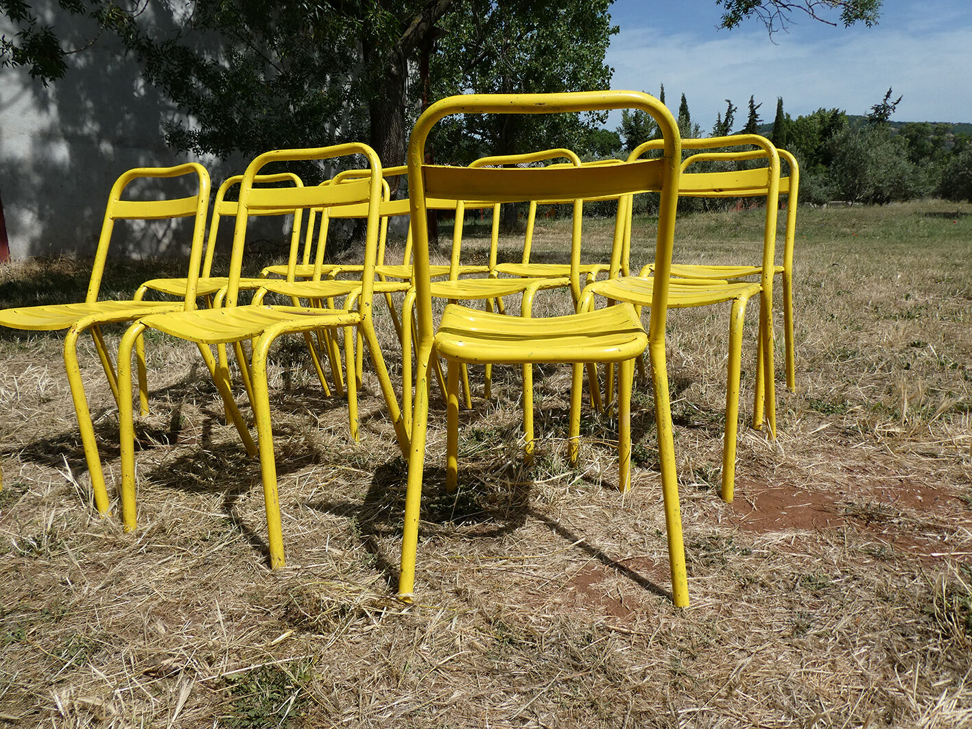 Lot of 11 yellow metallic bistro chairs from the 1950s