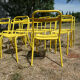 Lot of 11 yellow metallic bistro chairs from the 1950s