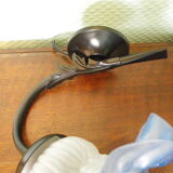 Wall sconces with opalines in the shape of corollas and black metal support