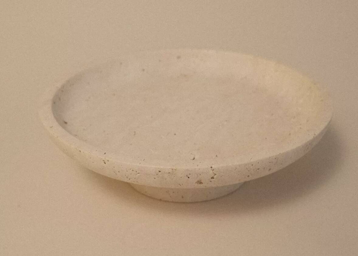 Travertine pocket emptier