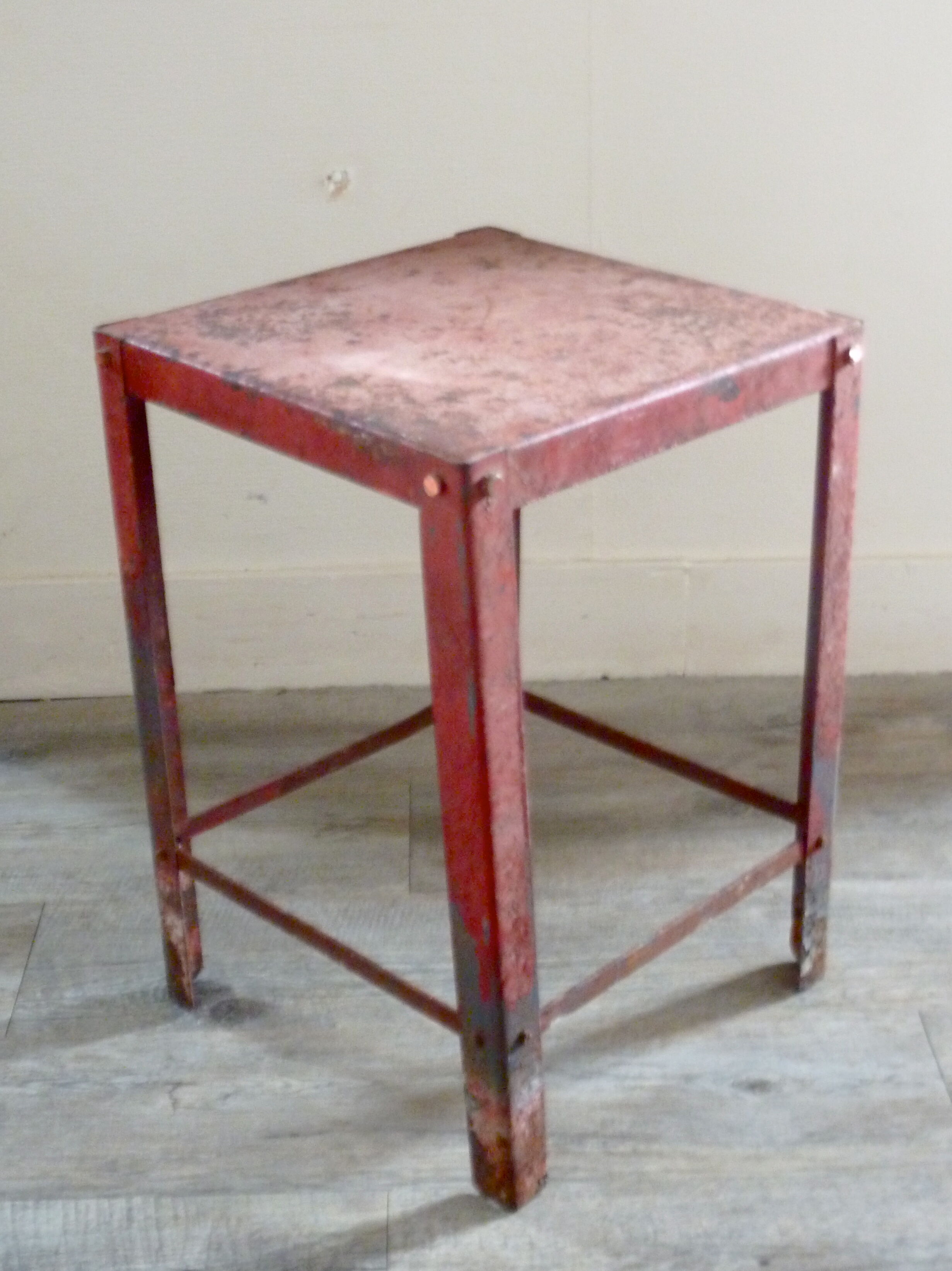 Red metal workshop stool