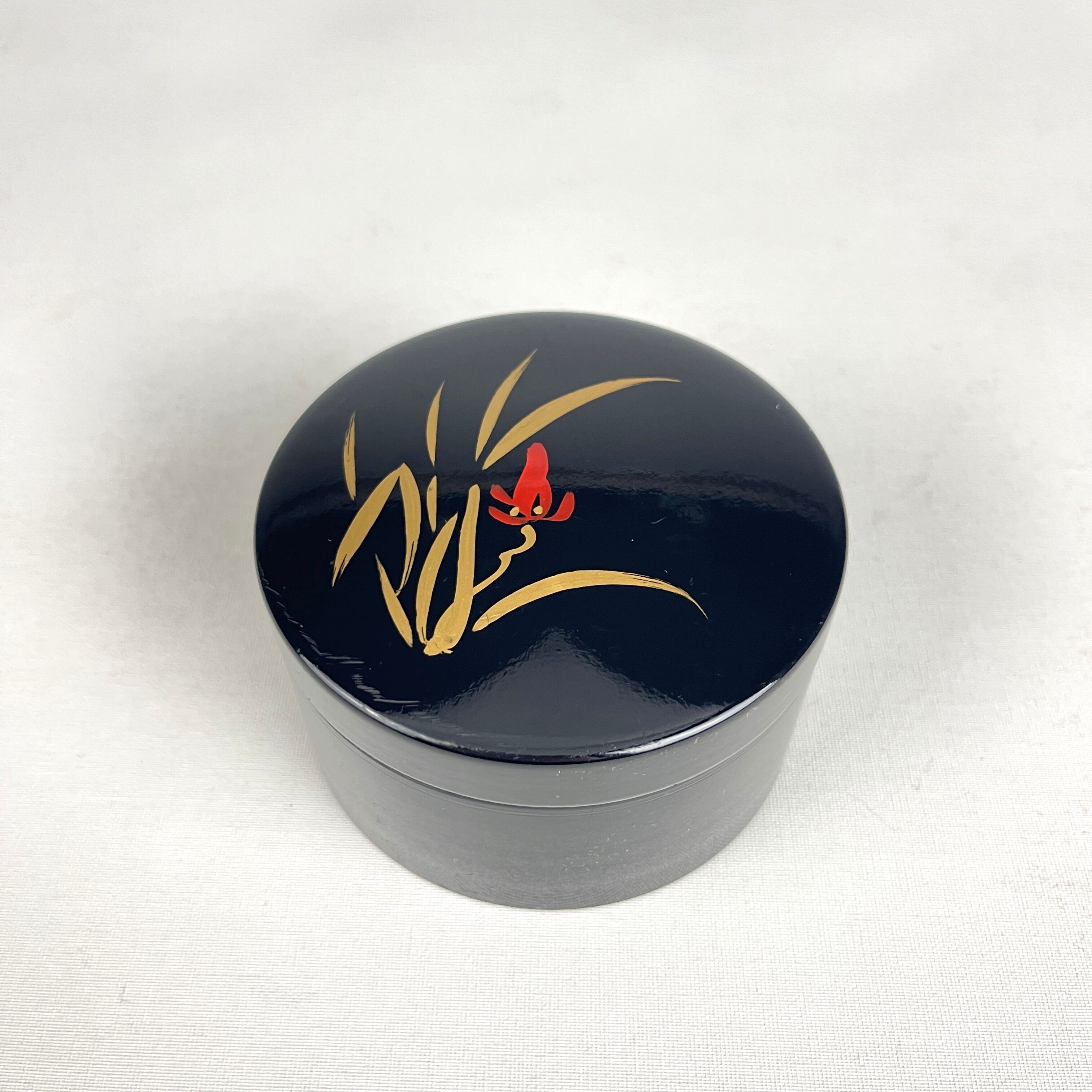 Coasters and their vintage black lacquered wooden box