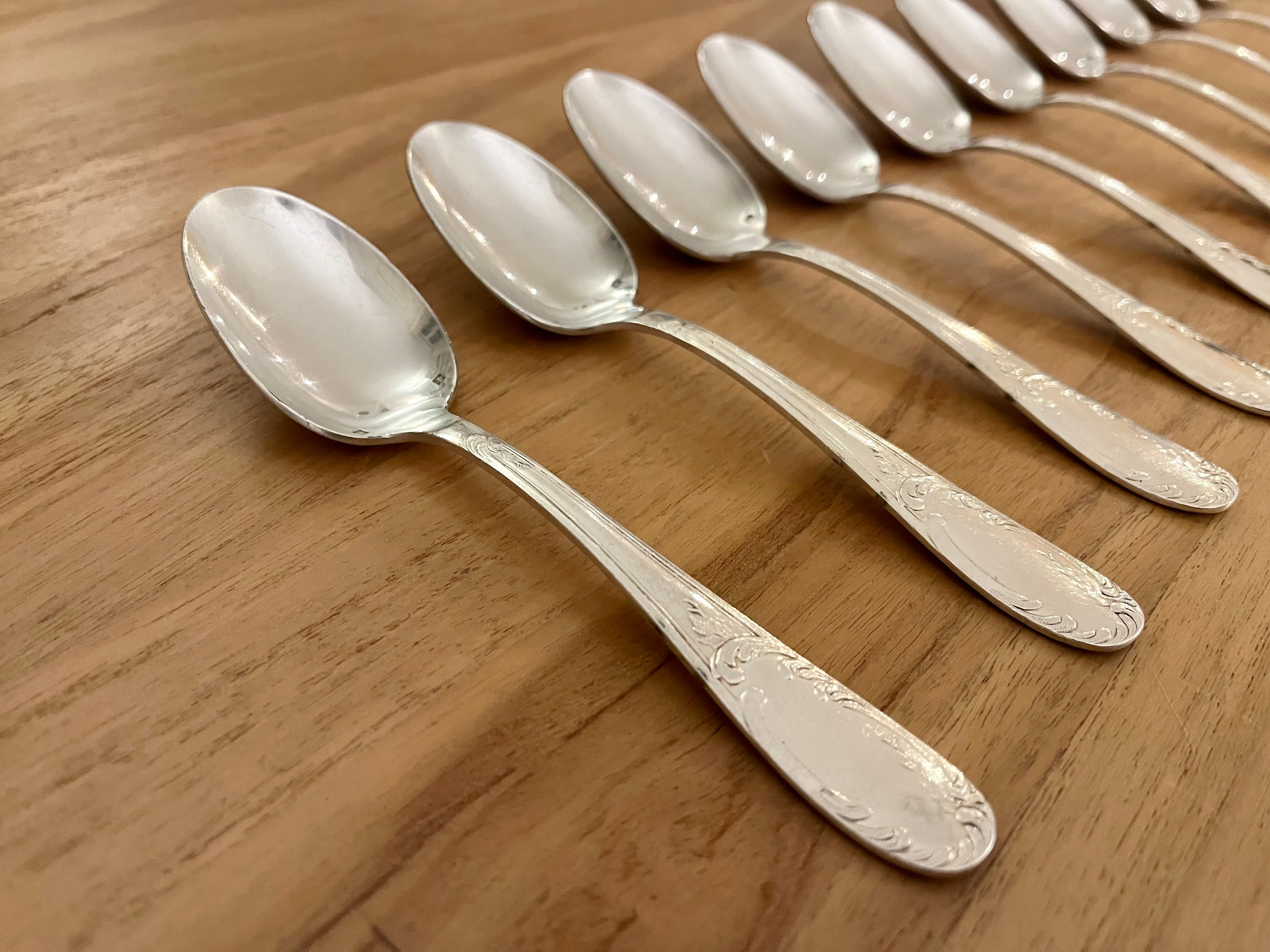 Set of 10 small silver metal spoons