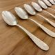 Set of 10 small silver metal spoons