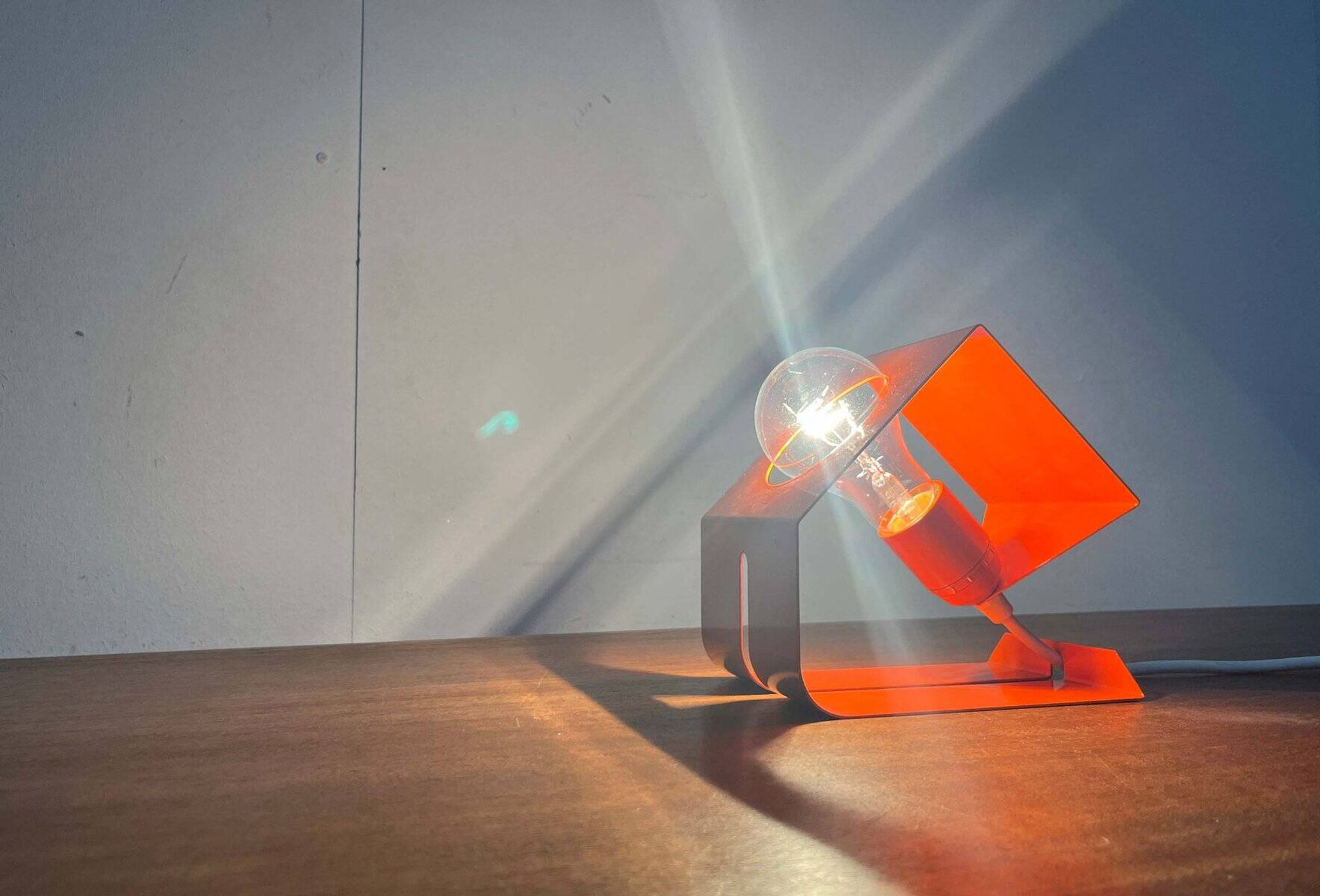 Orange metal table lamp, minimalist, modern mid-century space age, 1960s.