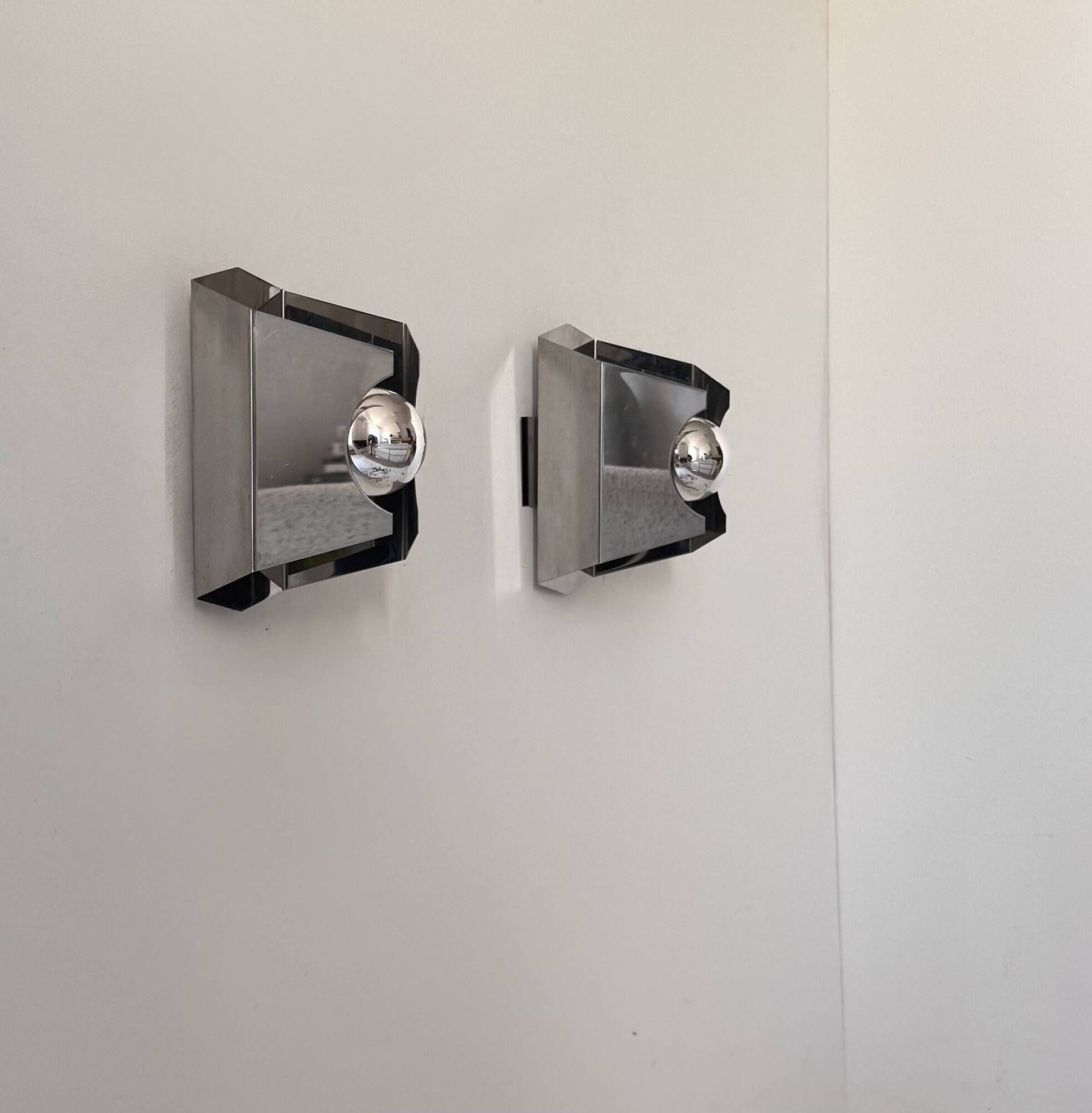 Pair of vintage geometric wall lights in chrome metal, France 1970.