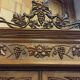 Art Nouveau buffet in carved oak with grapevine cluster decoration.