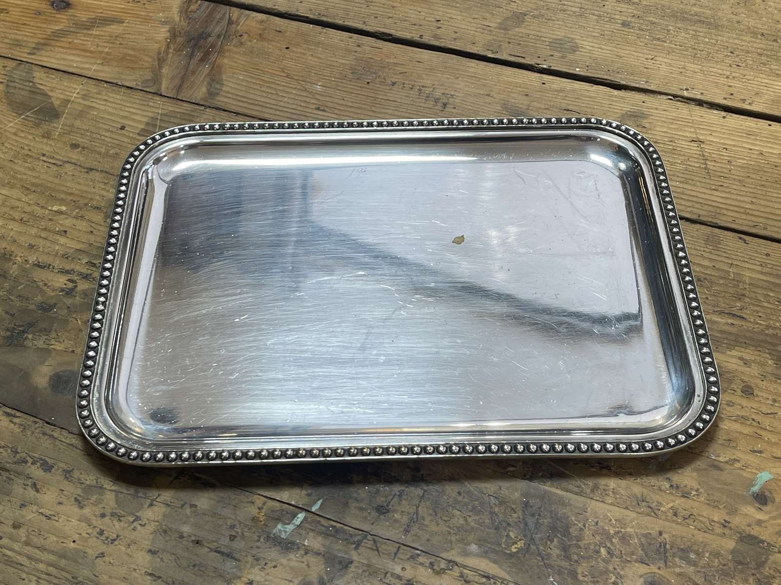 Small rectangular and beaded silver metal top