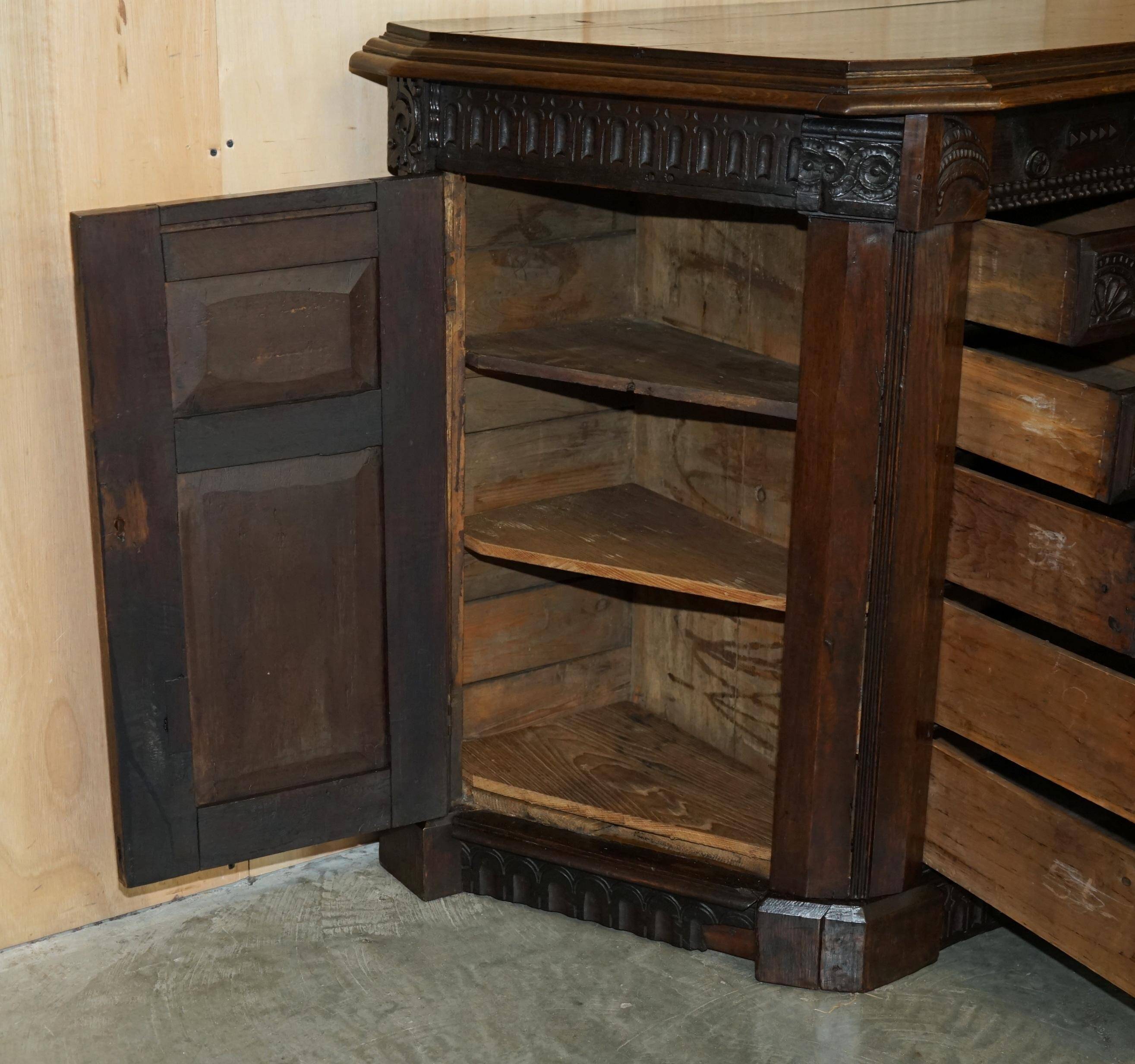 Hand-carved commode from 1685 with sideboards and side cupboards.