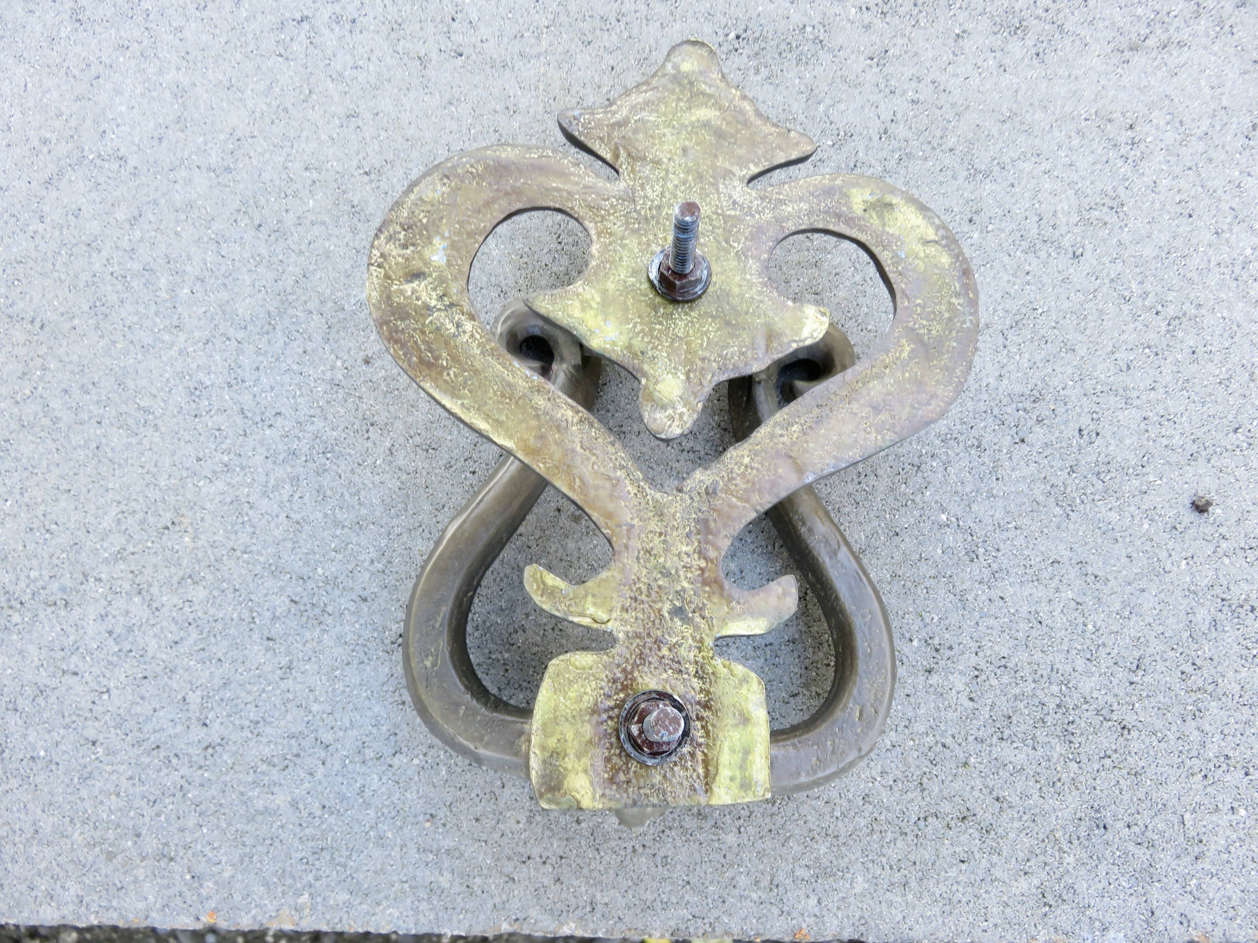 Impressive door knocker from the High Middle Ages in solid bronze.