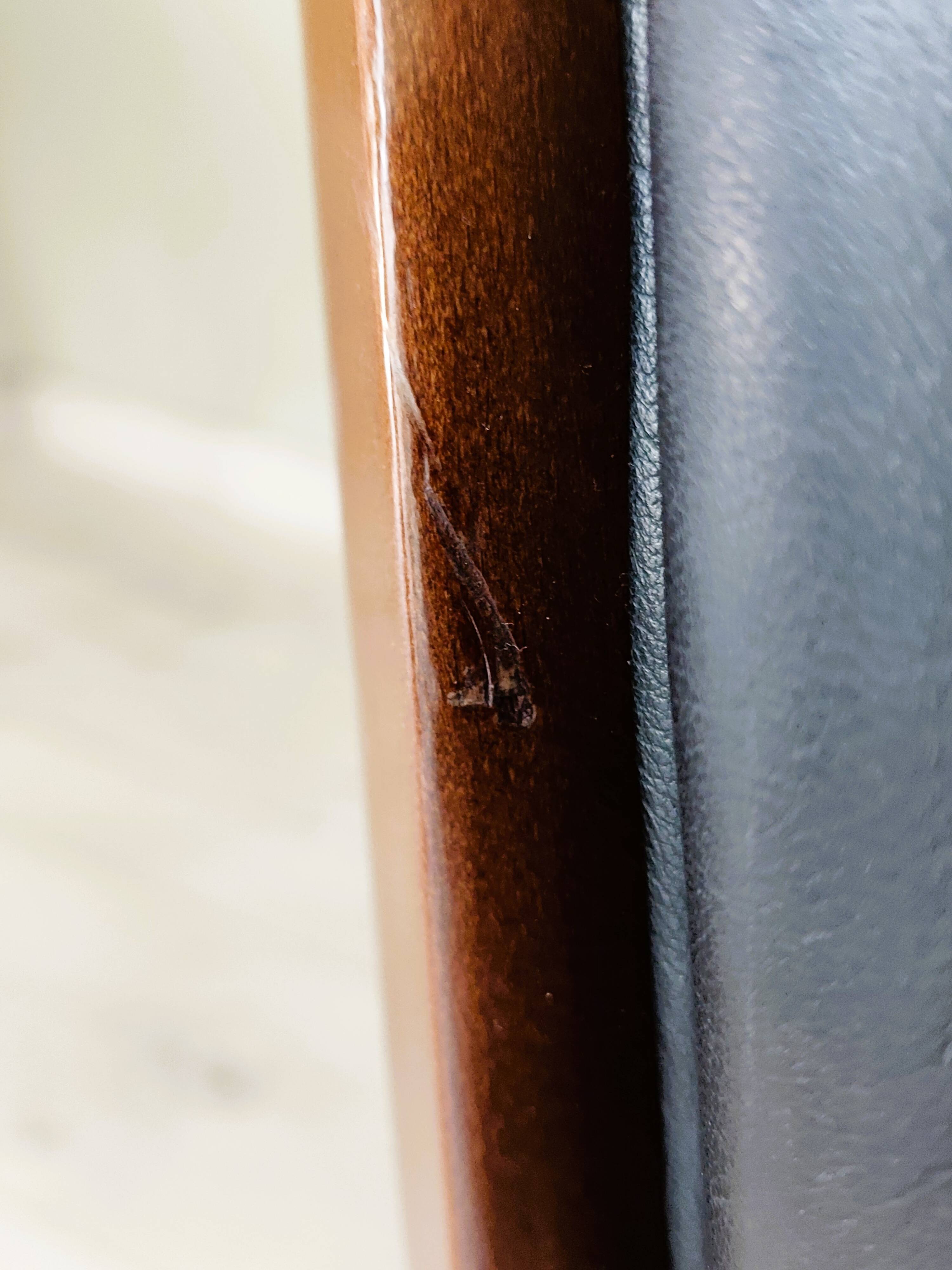 Black leather rocking Chesterfield armchair